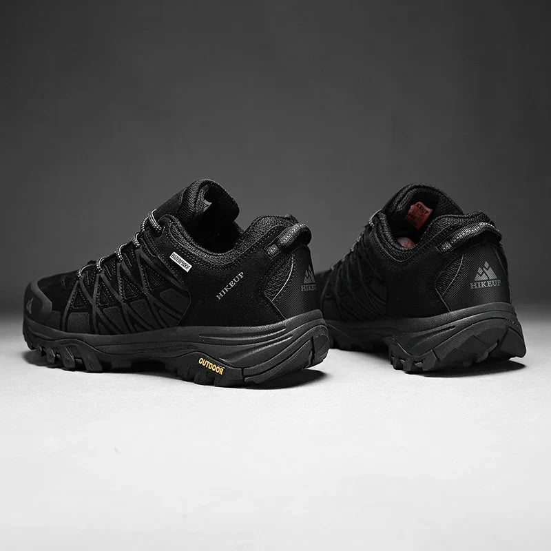 Black HIKEUP men's hiking shoes with rugged sole and breathable mesh, designed for durability and all-terrain grip.