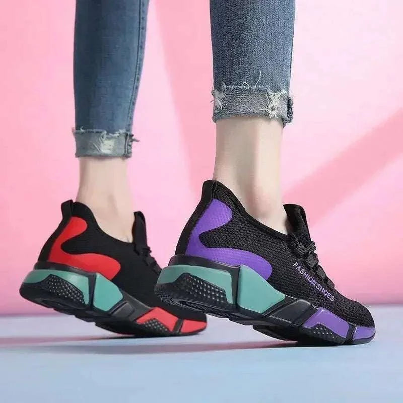 Lightweight and breathable women's shoes with stylish black design featuring red and purple accents, perfect for casual and sporty wear.