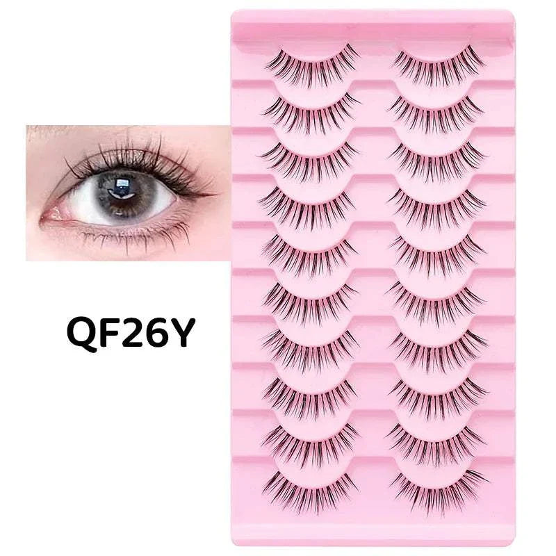 10 pairs of Natural Manga Full Strip Lashes with soft, voluminous synthetic fibers on a flexible band for anime-inspired eye looks