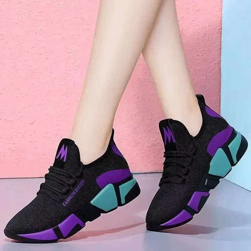 Stylish black women's shoes with purple and teal accents, breathable and lightweight for casual and sporty wear.