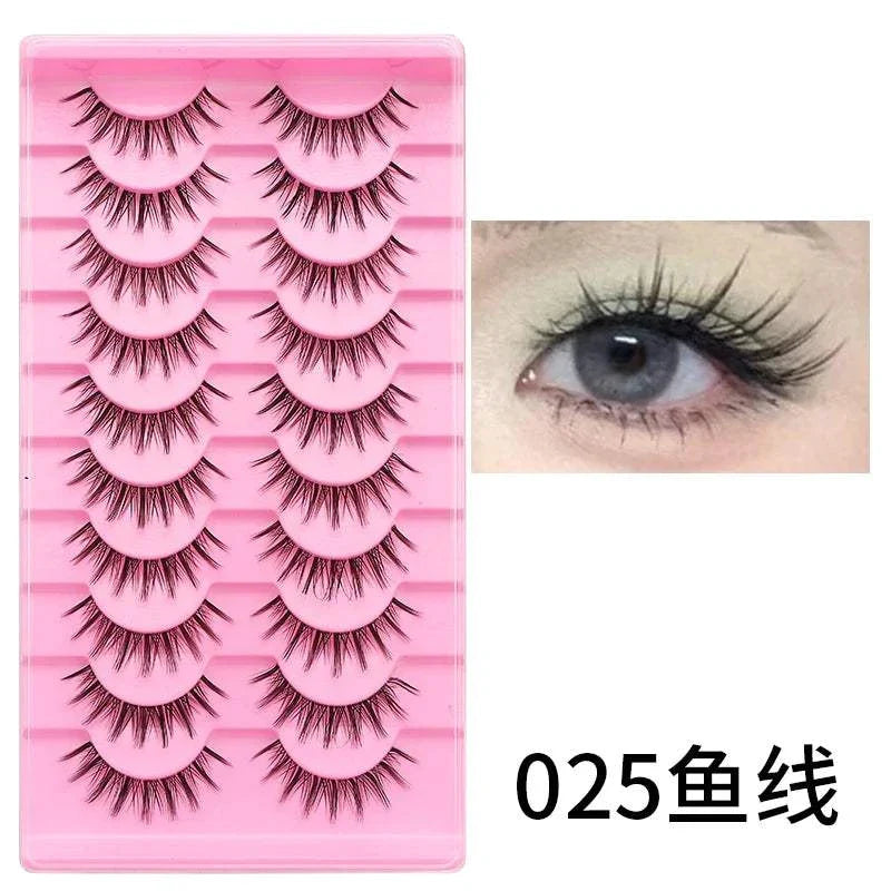 10 pairs of natural manga full strip lashes in a pink tray with a close-up of an eye wearing the lashes, showcasing lightweight, voluminous, anime-inspired style