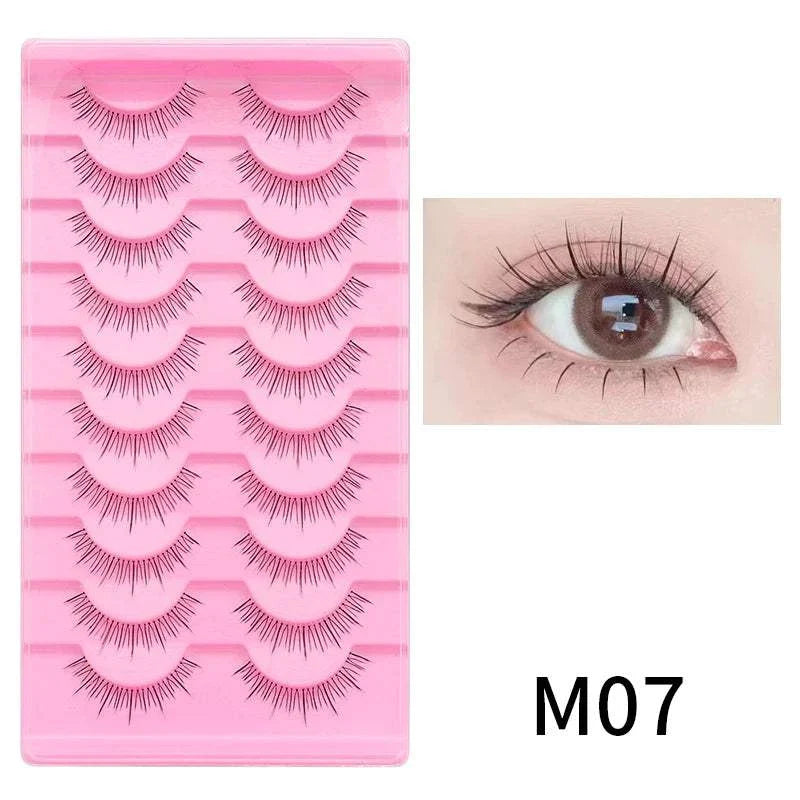 10 pairs of Natural Manga full strip lashes in pink tray with close-up of applied lashes on eye, style M07