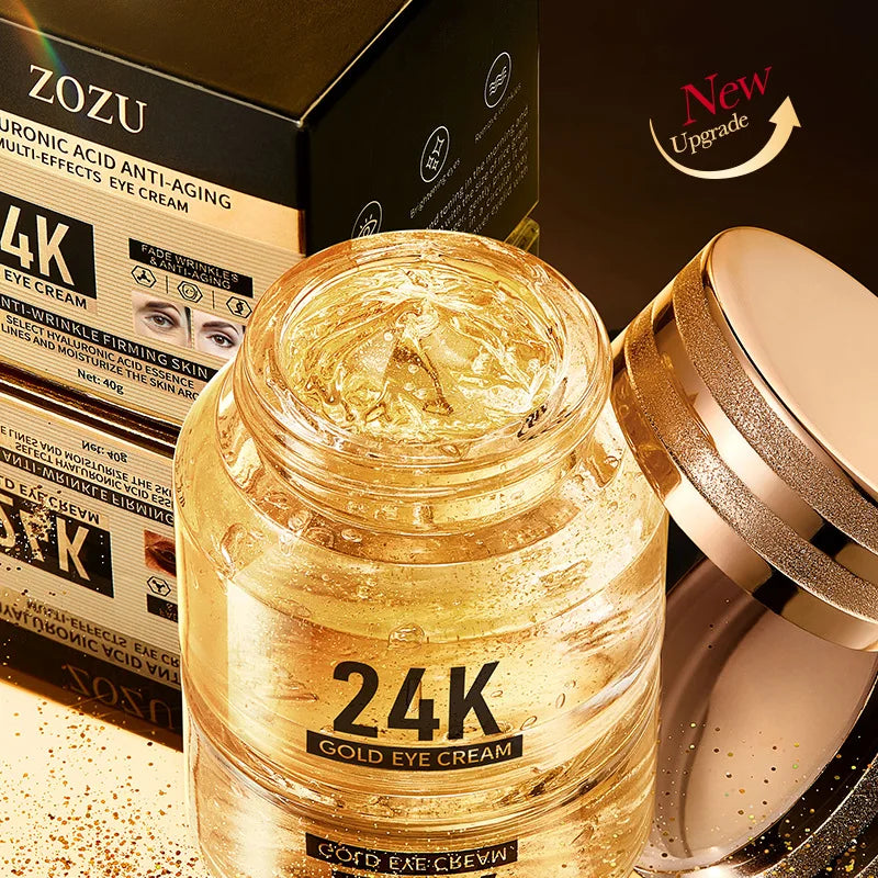 24K Gold Hyaluronic Acid anti-aging eye cream jar with gold flakes and packaging box on gold background