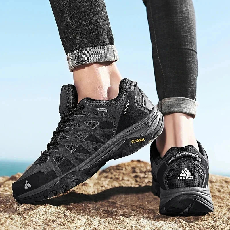 Men's black Hikeup hiking shoes with durable construction and superior grip on rocky terrain.