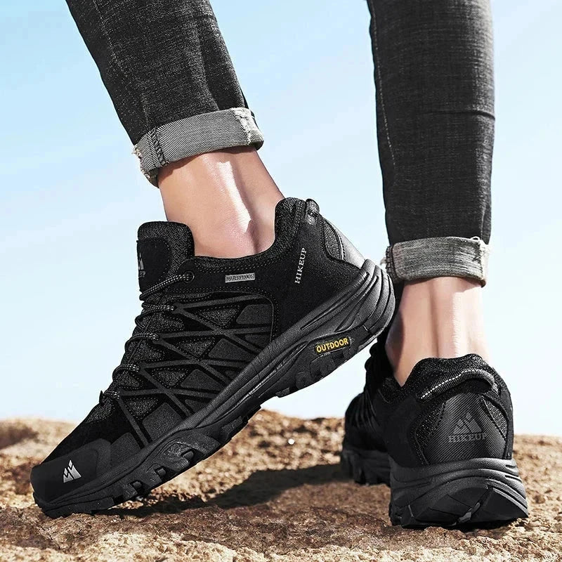 Black HIKEUP men's hiking shoes with durable construction, superior grip, and breathable mesh design for outdoor adventure.