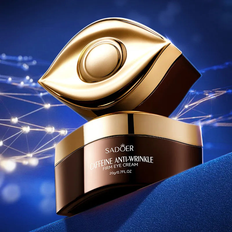 SADOER Caffeine Eye Cream jar with gold eye-shaped lid on blue background for brightening and firming under eyes