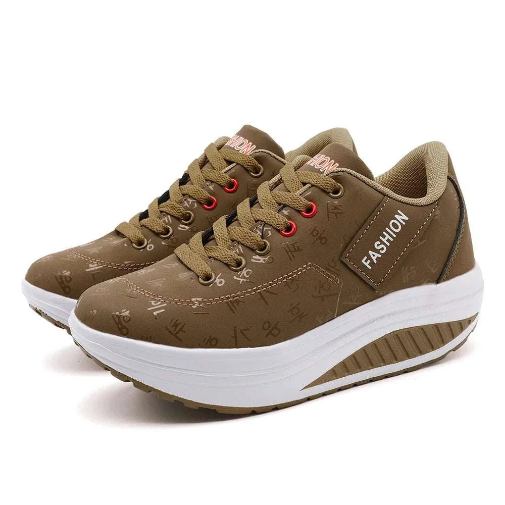 Brown breathable wedge heel sneakers with lace-up closure and thick cushioned sole for women