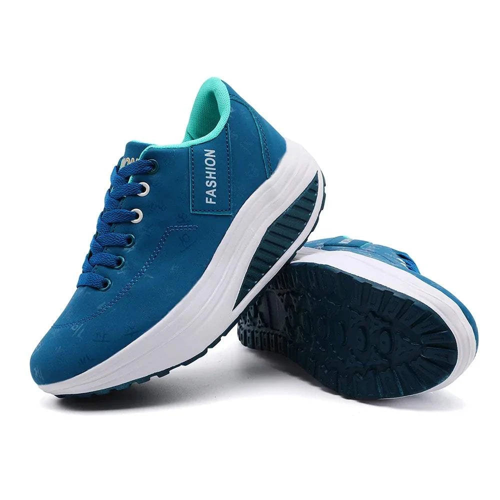 Blue breathable wedge heel sneakers with lace-up closure and cushioned white sole for casual sports and everyday wear