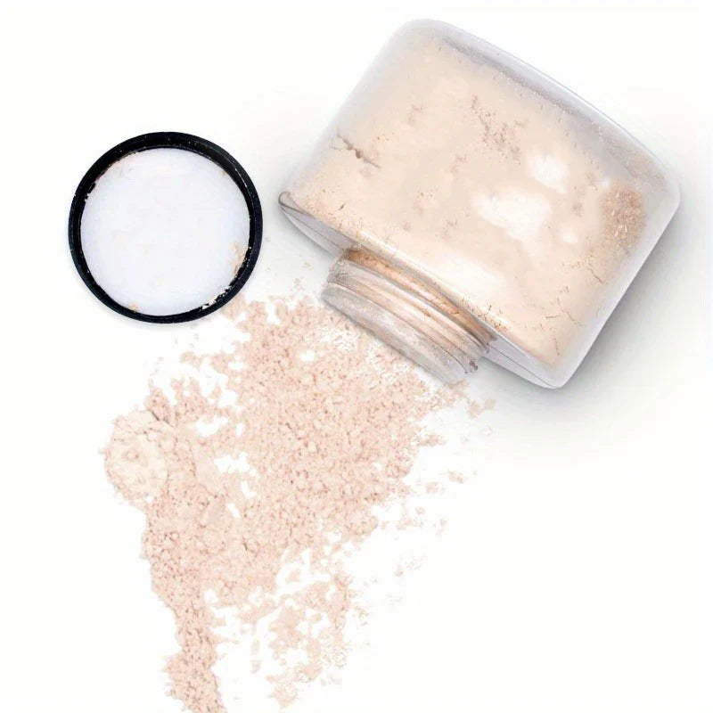 luxury loose banana powder spilled from a clear jar with black lid on white background for smooth matte finish makeup setting