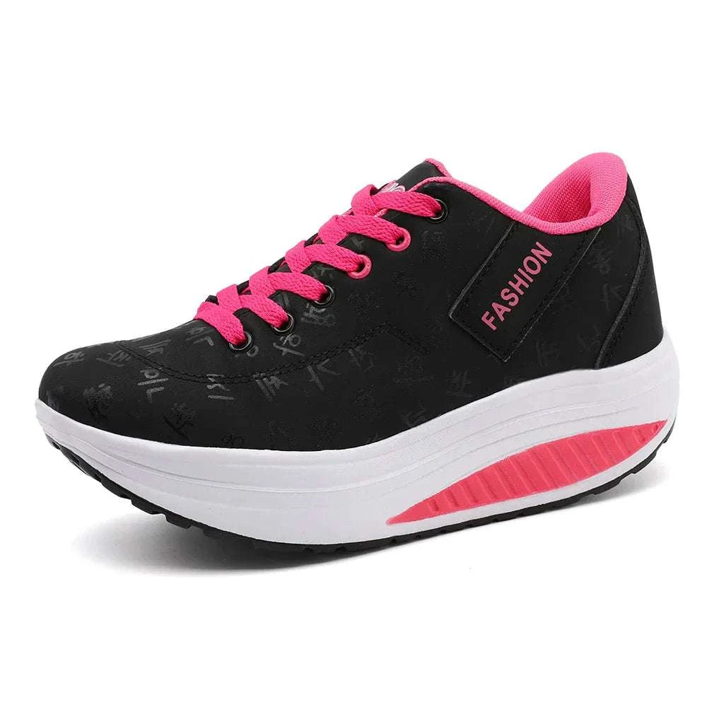 Black and pink breathable wedge heel sneakers with lace-up closure and cushioned sole for women