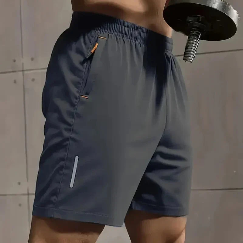 Men’s breathable sports shorts in dark color with elastic waistband and quick-dry fabric ideal for workouts and summer comfort