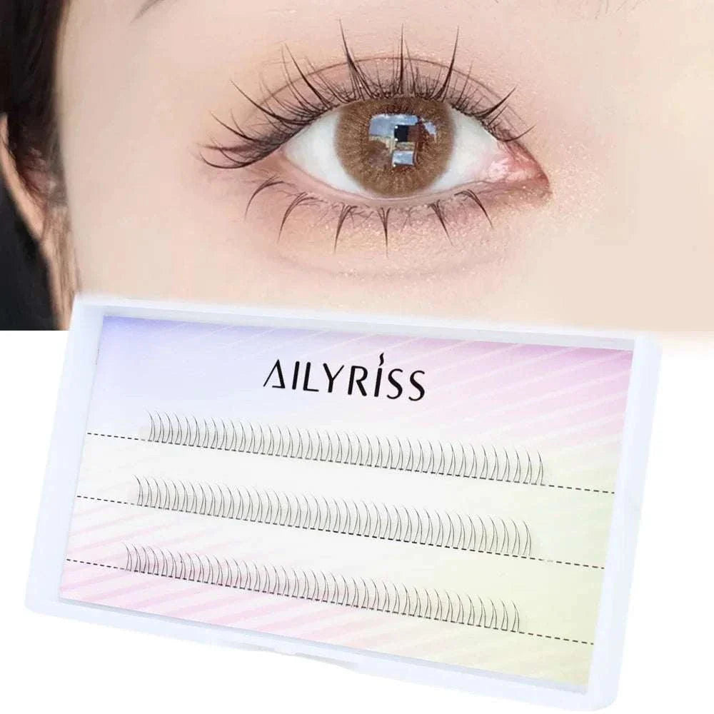 Close-up of eye with J Curl V Shape under eyelash clusters and packaging box of Ailyriss soft manga-inspired bottom lashes