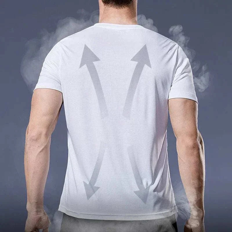 Back view of a man wearing a white men’s quick-dry compression sport t-shirt showing breathable, moisture-wicking fabric with airflow arrows.