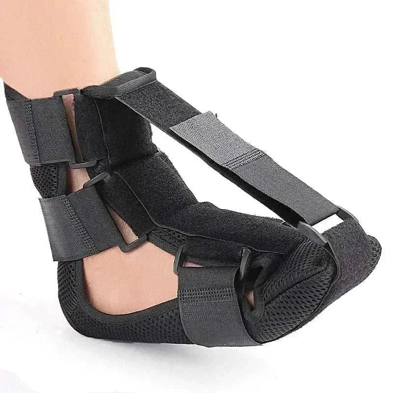 Adjustable black night splint for plantar fasciitis providing arch and heel support to relieve foot pain.