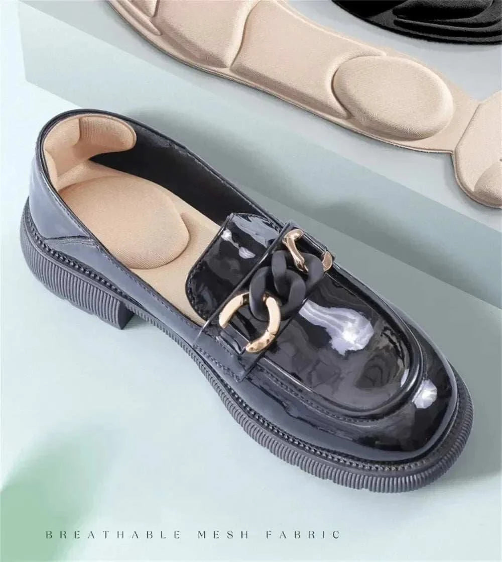 Memory foam high-heel insoles for women inside a black patent leather shoe with breathable mesh fabric design