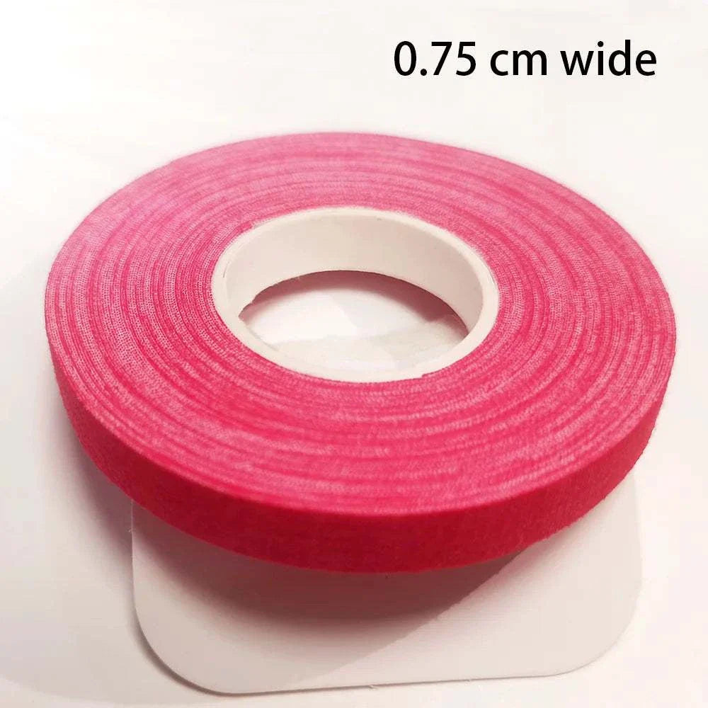 Roll of pink Jiu-Jitsu bandage elastic finger tape, 0.75 cm wide, self-adhesive and stretchable for martial arts support.