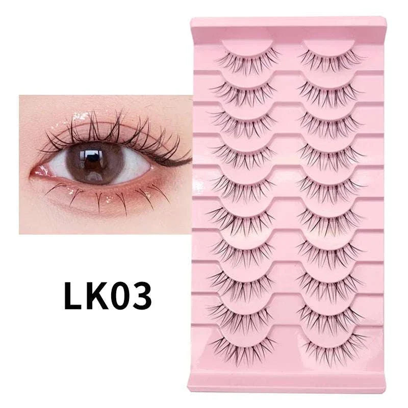 10 pairs of natural manga full strip lashes in pink tray with close-up on applied lash look