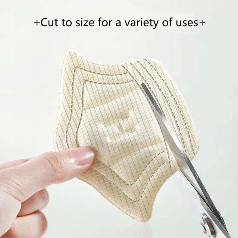 Hand cutting unisex heel cushion pads for shoe comfort and protection, customizable fit with soft, anti-wear material.