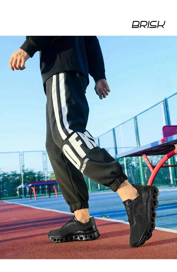 Men's black ultraboost running shoes with breathable mesh and cushioned support on outdoor track
