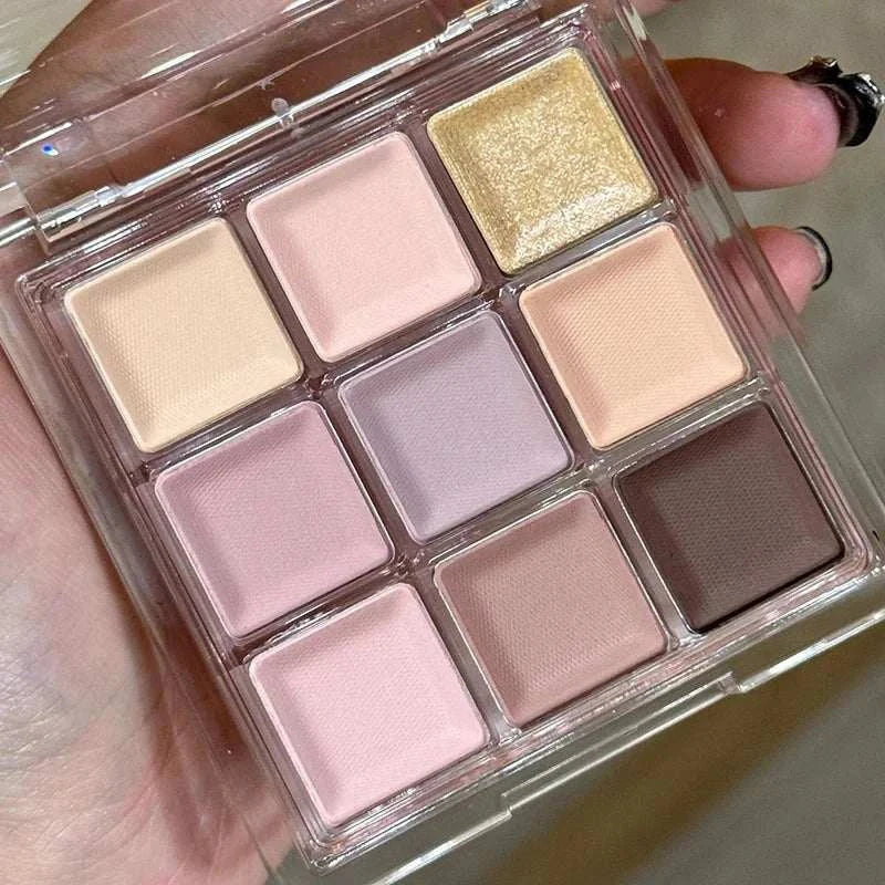 Black Pink Smoky Eye shadow palette with matte and pearlescent pink, black, and chocolate-inspired shades in a compact case