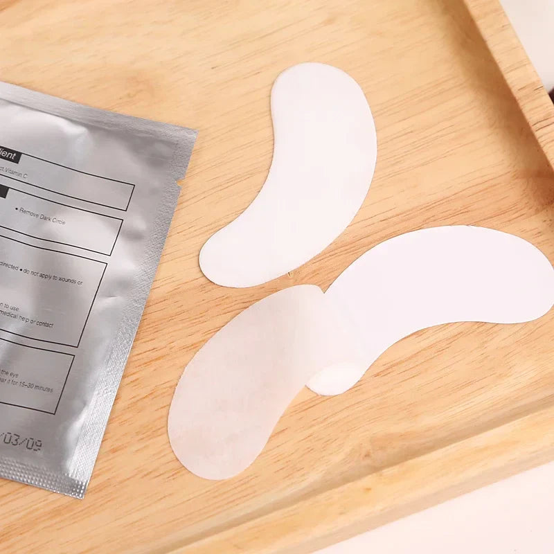 Eyelash extension gel eye pads with hydrogel backing on wooden tray for under-eye protection during lash application