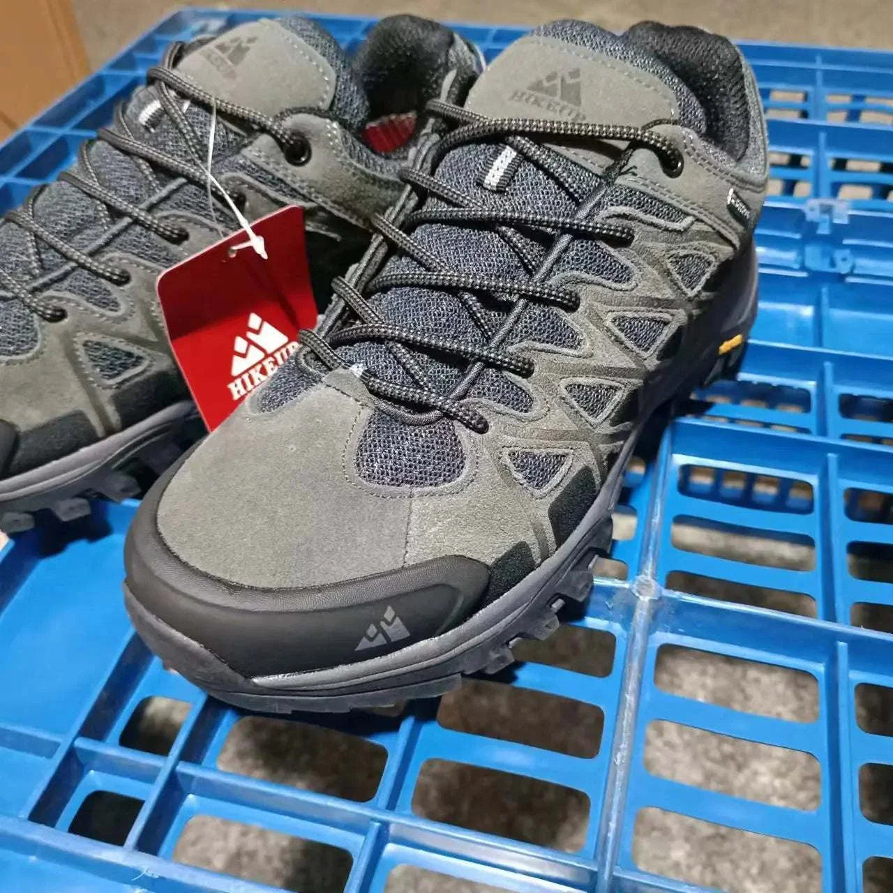 Durable gray men's hiking shoes with breathable mesh and rugged sole for all-terrain grip and comfort