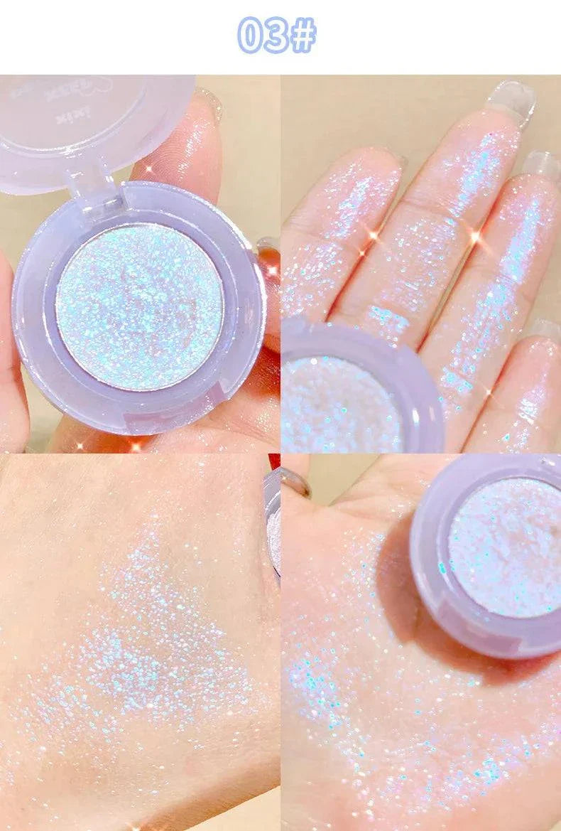 Diamond Glitter Monochrome Eyeshadow Palette showing shimmering light blue glitter eyeshadow swatches on fingers and hand with compact container.