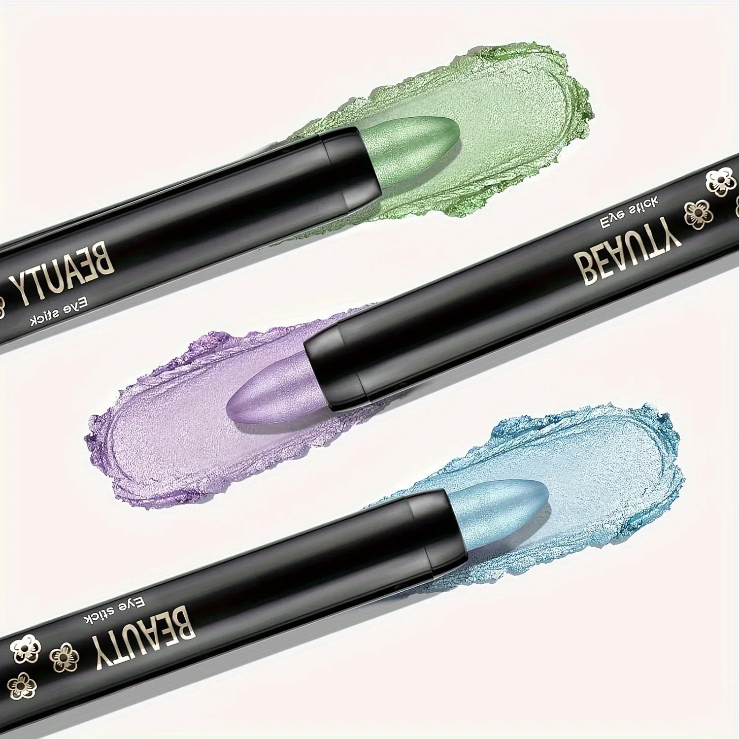 16-color pearlescent glitter eyeliner sticks with green, purple, and blue shades swatched on a light background