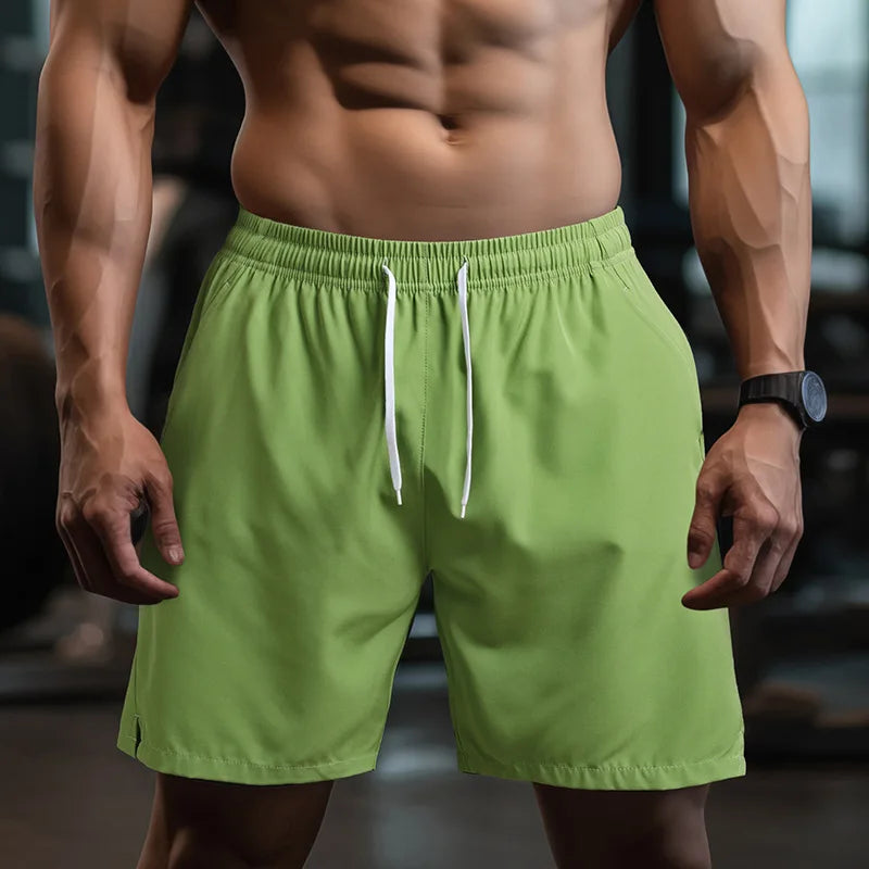 Men's breathable and quick-drying performance shorts with elastic waistband and drawstring in green color