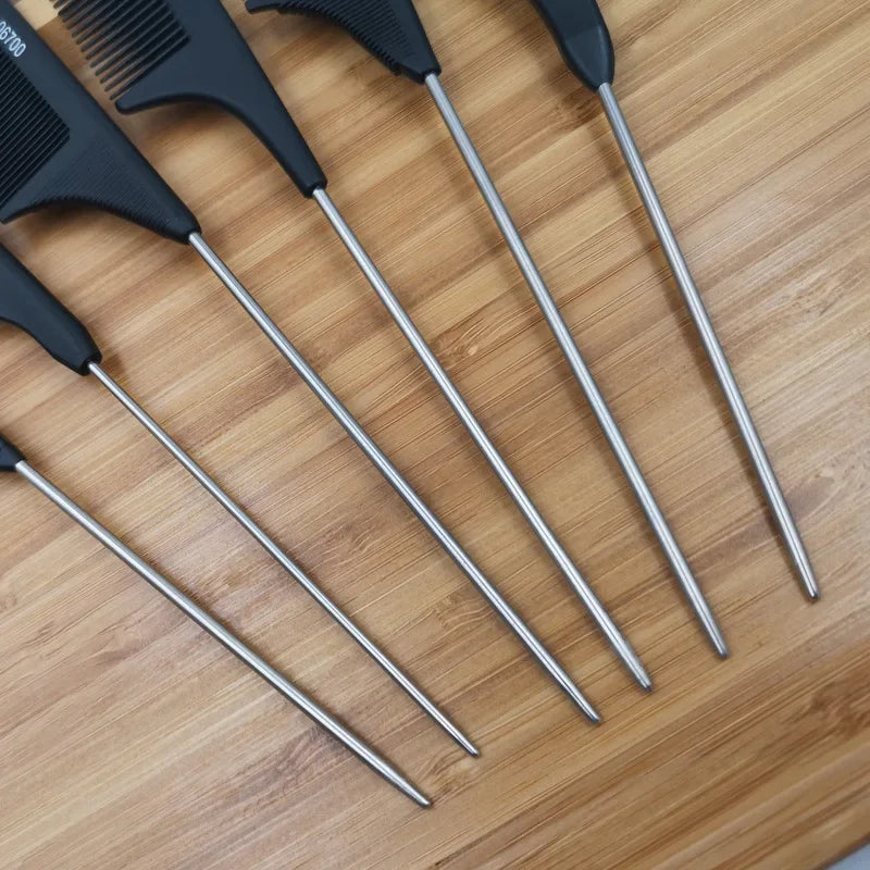 Set of professional hair tail combs with stainless steel tails and black handles on a wooden surface