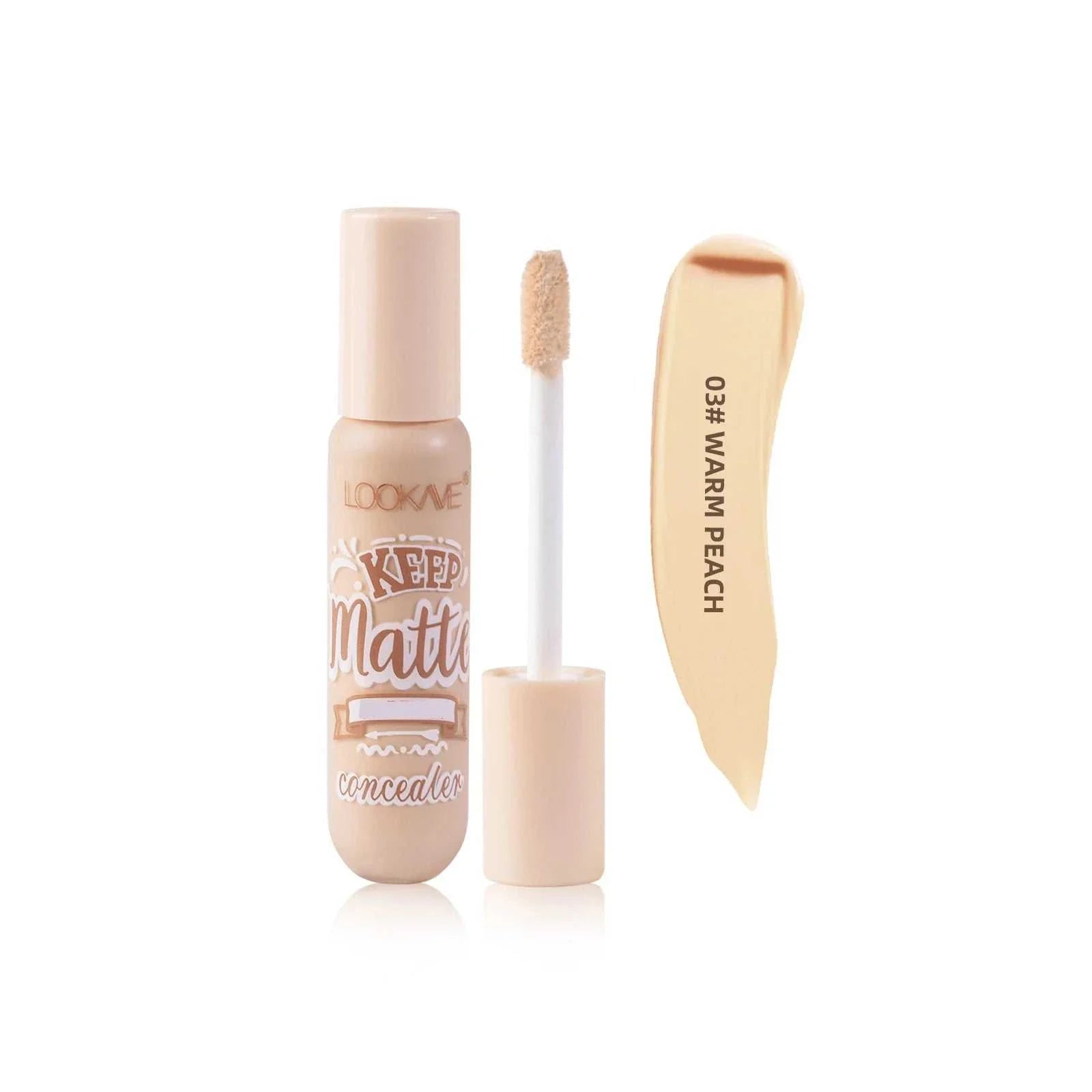 Liquid concealer stick foundation cream in warm peach shade with applicator wand and swatch sample