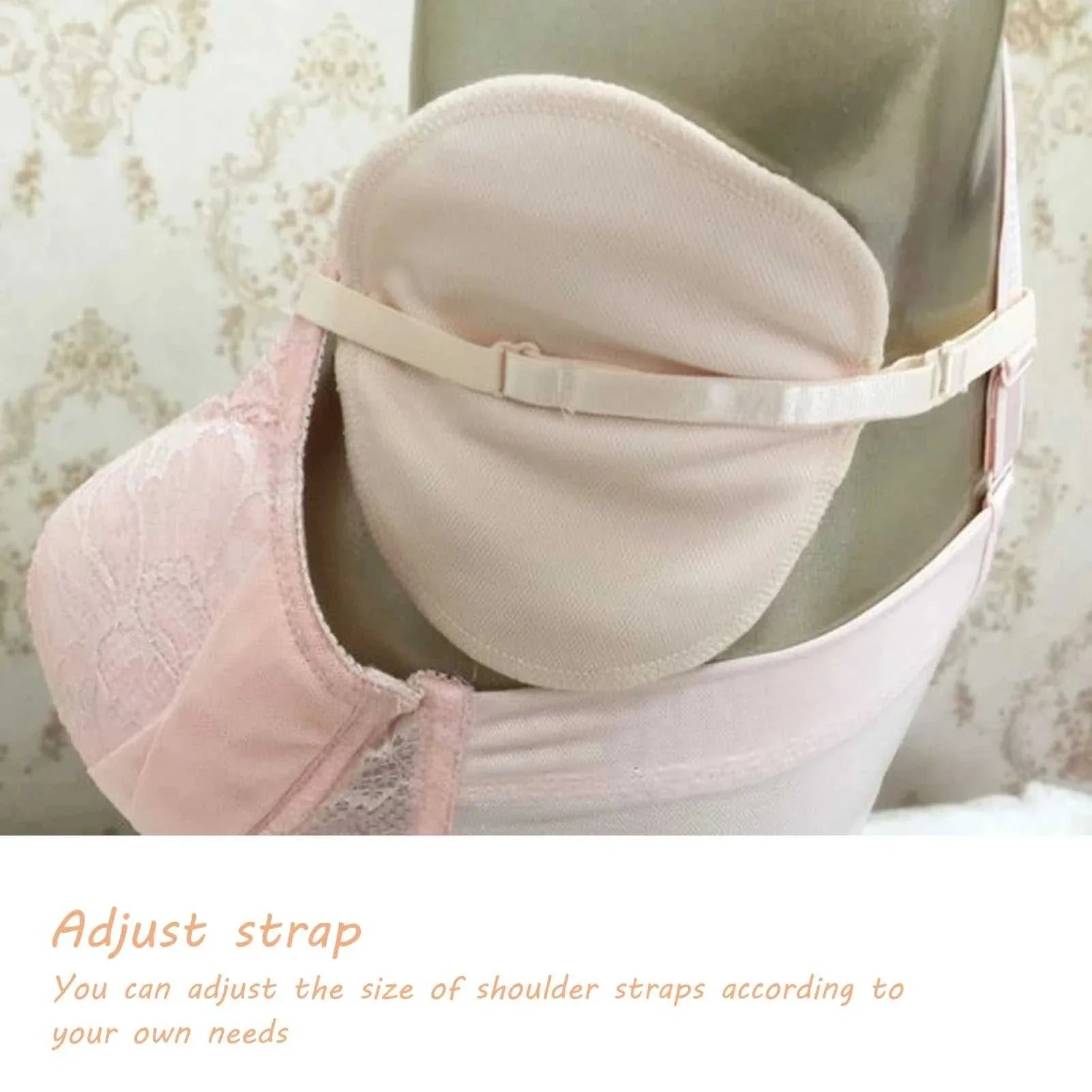 Reusable cotton underarm sweat pad with adjustable strap shown under a pink bra on a mannequin.