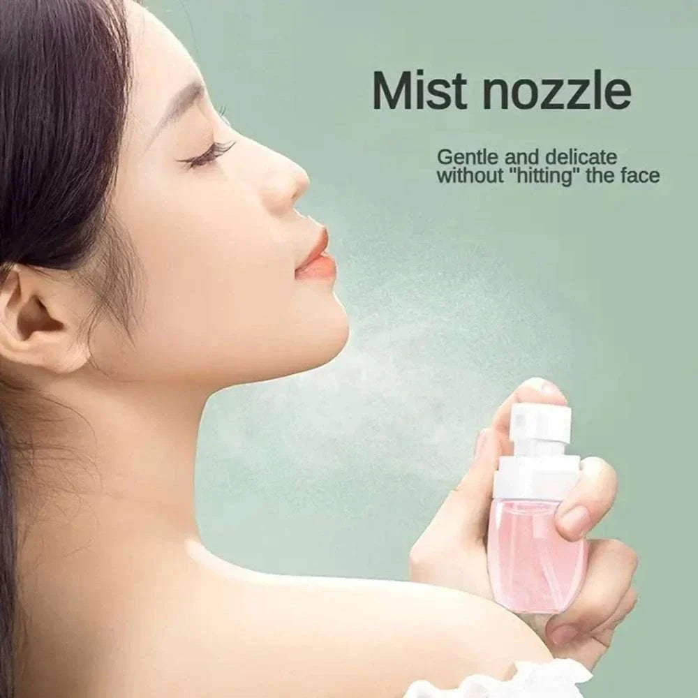 Woman using mini travel spray bottle with fine mist nozzle for gentle facial hydration