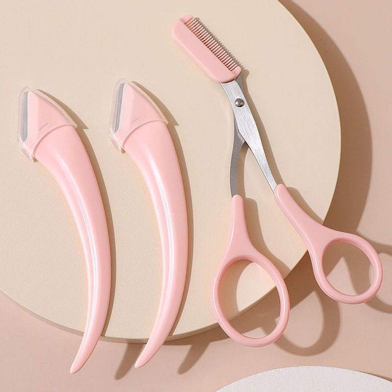 Karsyngirl Eyebrow Trimming Knife Set with 2 pink razors and eyebrow scissors with built-in comb for precise grooming and shaping.