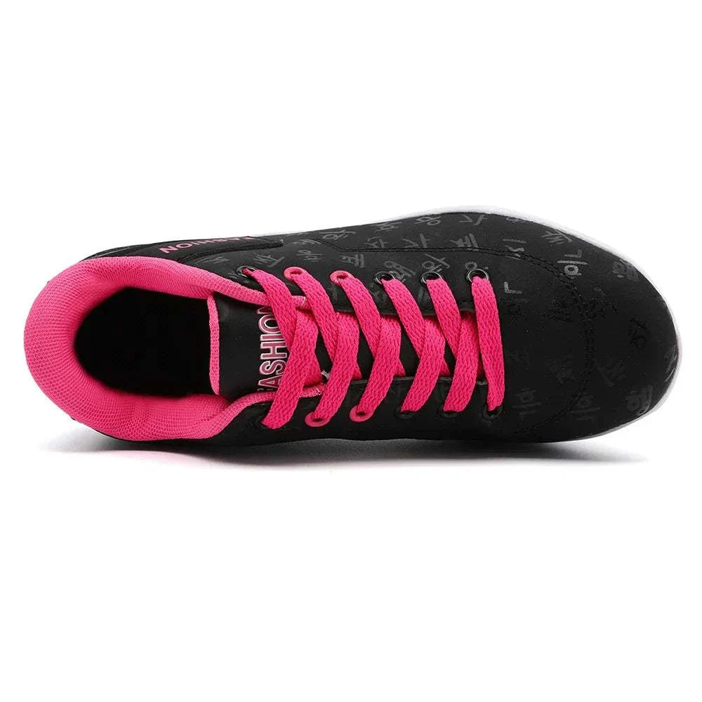 Black breathable wedge heel sneaker with bright pink laces and inner lining, designed for casual sports and comfortable wear.