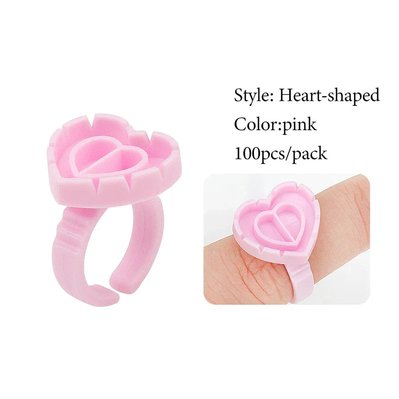 Pink heart-shaped disposable glue ring cup for lash extensions and tattoo pigments, pack of 100
