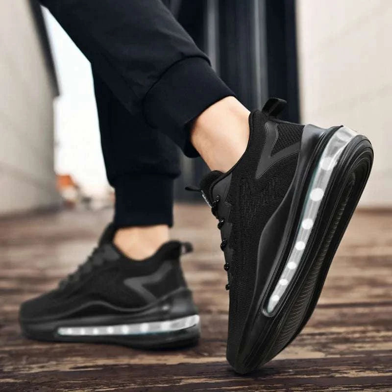 Black breathable unisex sneaker with vulcanized rubber sole, lightweight mesh upper, and cushioned air sole for comfort and traction.