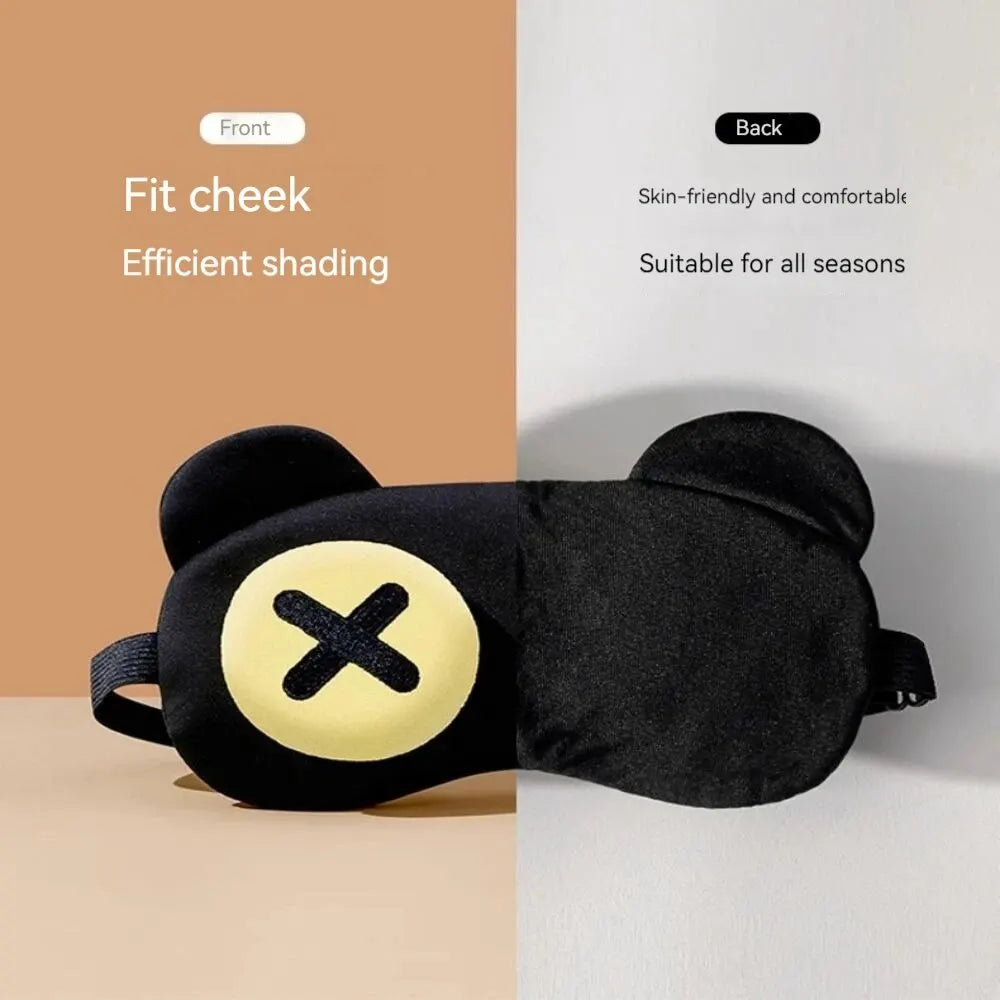 Black cute eye mask with bear ears and yellow cross design, soft and breathable for kids, adjustable strap for comfortable fit