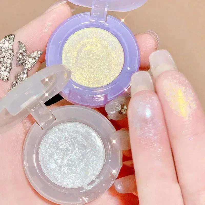 Diamond Glitter Monochrome Eyeshadow Palette with shimmering gold and silver shades showing sparkling swatches on fingers