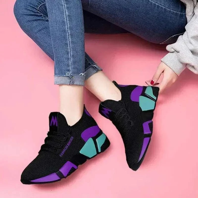 Women's shoes with black, purple, and teal sporty lightweight design and lace-up closure for casual wear