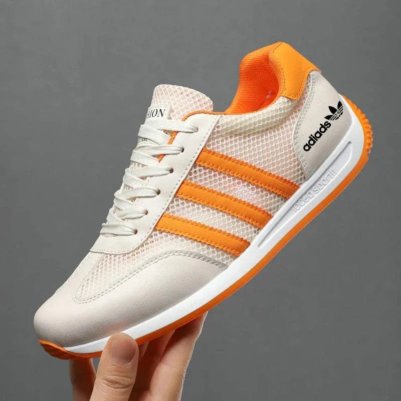 Lightweight men's casual sport shoe with breathable mesh upper and orange accents for running and everyday wear