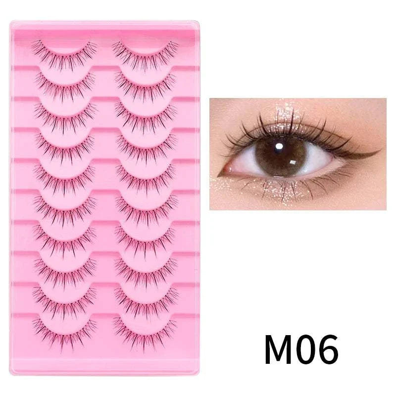 10 pairs of natural manga full strip lashes in pink tray with close-up of eye wearing lashes, style M06