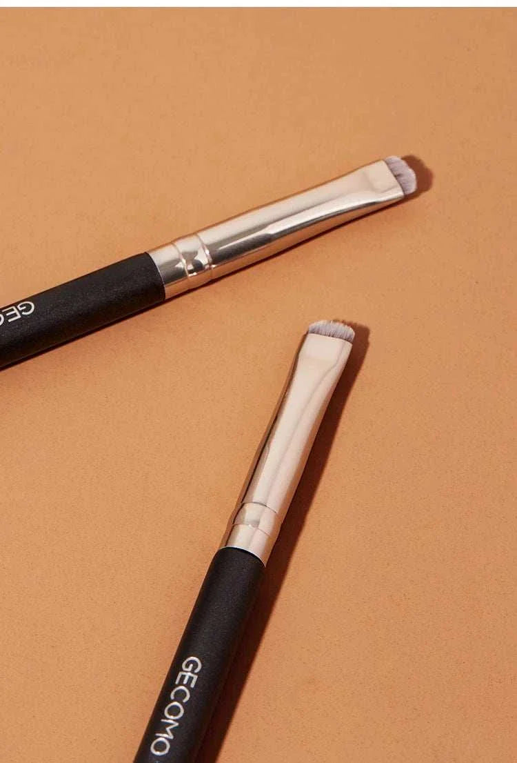 Eyeliner and eyebrow makeup brush set with black handles and angled soft bristles for precise eye makeup application