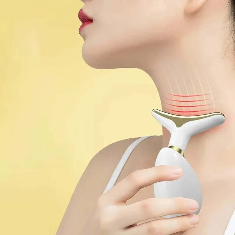 Woman using Neck Lifting Beauty Device on neck for anti-aging and skin firming with heat therapy.