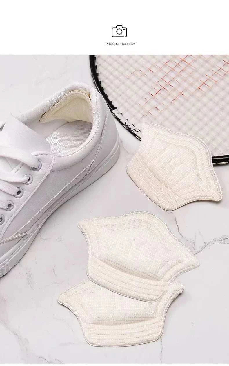 White unisex anti-wear heel cushion pads for shoe comfort and protection.