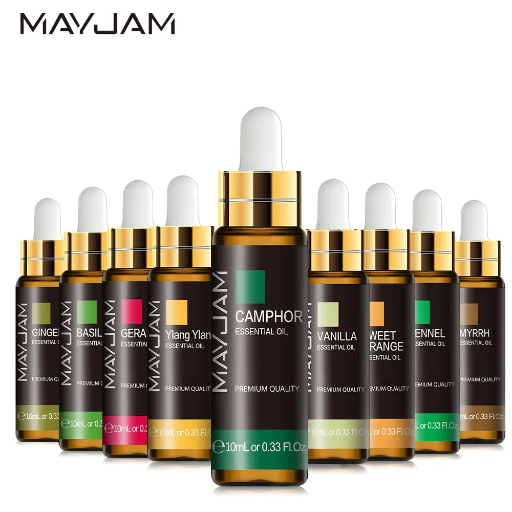 Collection of MAYJAM Essential Oil bottles with dropper featuring various scents including camphor, vanilla, and sandalwood in amber glass bottles with gold caps