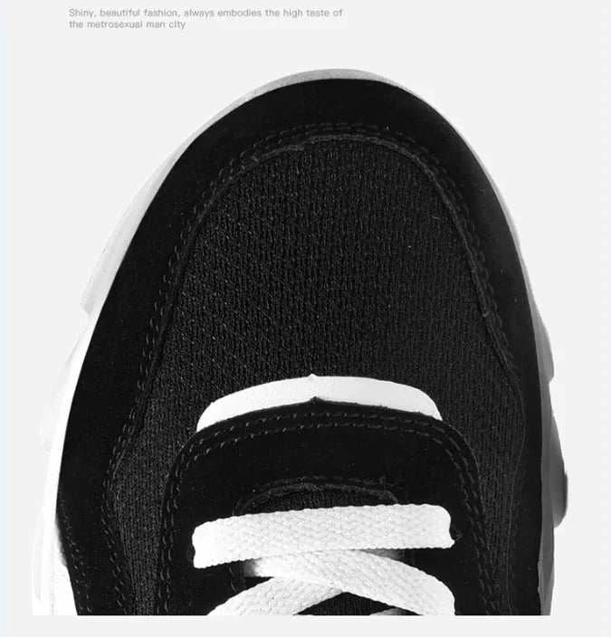 2025 new men's and women's running shoe with breathable black mesh upper, white laces, and anti-slip sole.